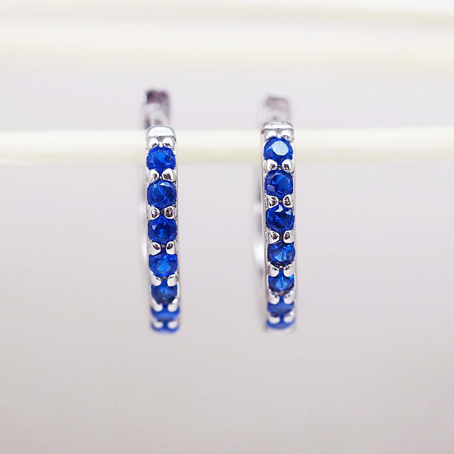 silver huggie earrings with blue cubic zirconias - womens sterling silver jewellery by Australian jewellery brand indie and harper