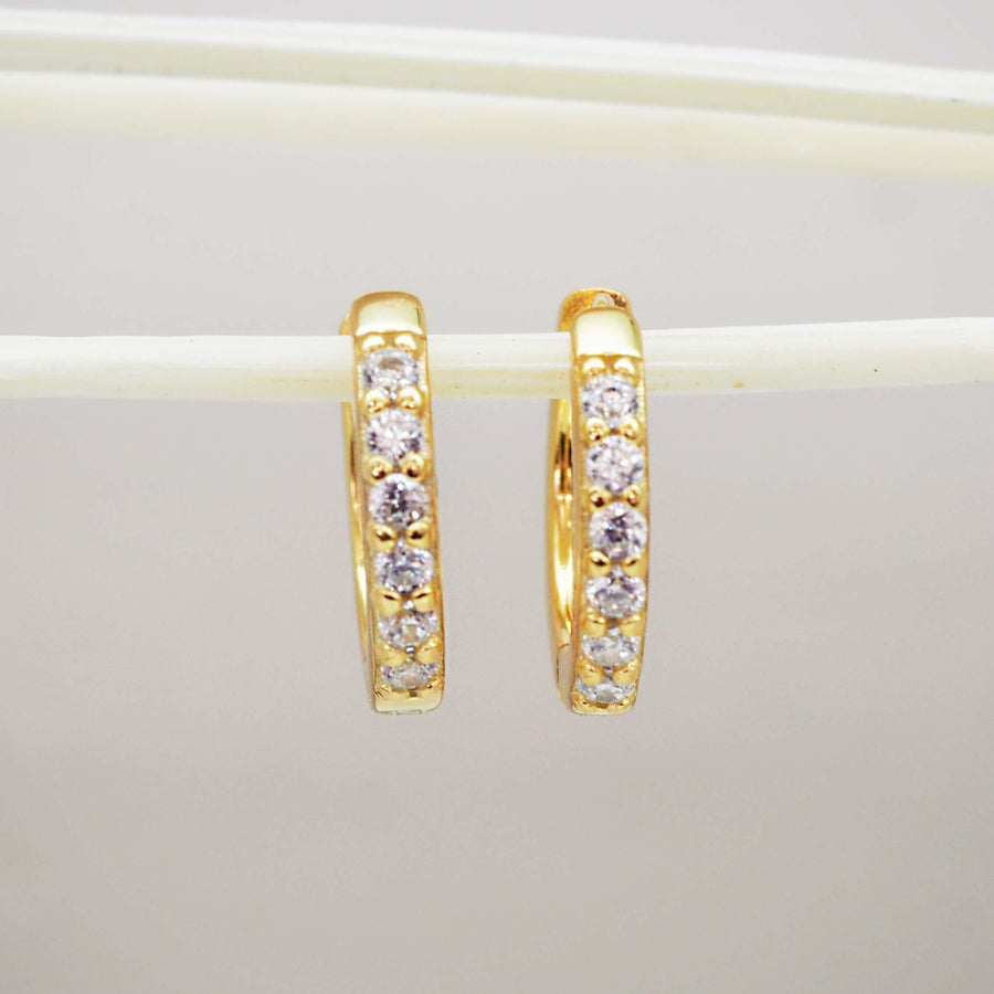 Gold huggie earrings with cubic zirconias - womens gold jewellery by Australian jewellery brand indie and harper