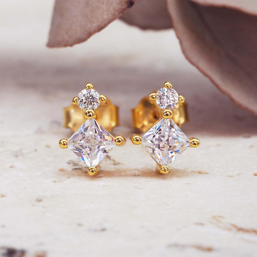 dainty gold stud earrings with cubic zirconias