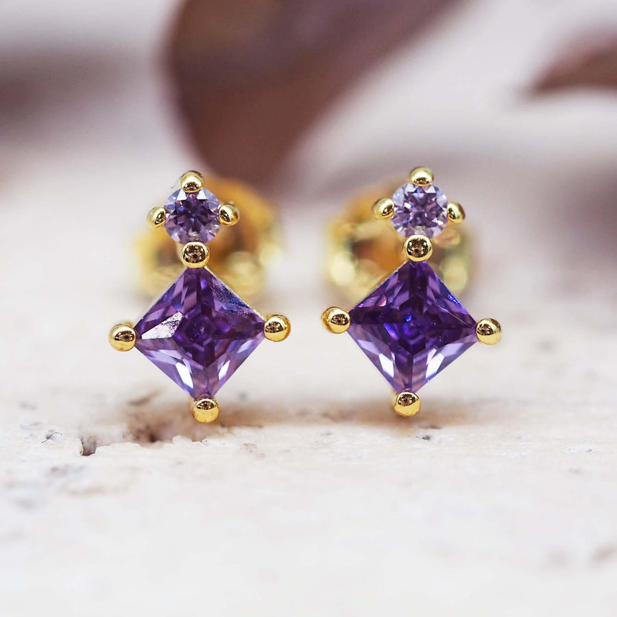 dainty gold stud earrings with purple crystals 