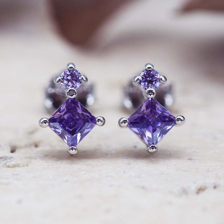dainty sterling silver stud earrings with purple crystals