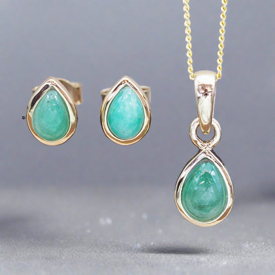 May Birthstone jewellery set featuring gold emerald earrings and gold emerald necklace