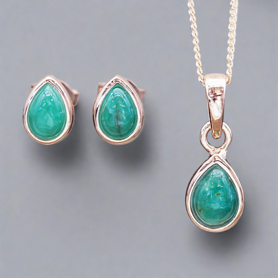 May Birthstone jewellery set featuring rose gold earrings and rose gold necklace both made with emerald gemstones
