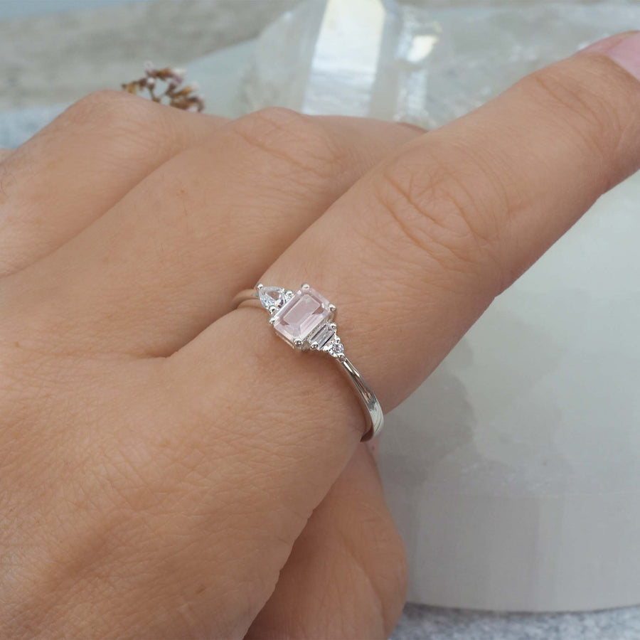 Finger wearing white topaz and rose quartz ring - women's rose quartz jewellery - promise rings by Australian jewellery brand