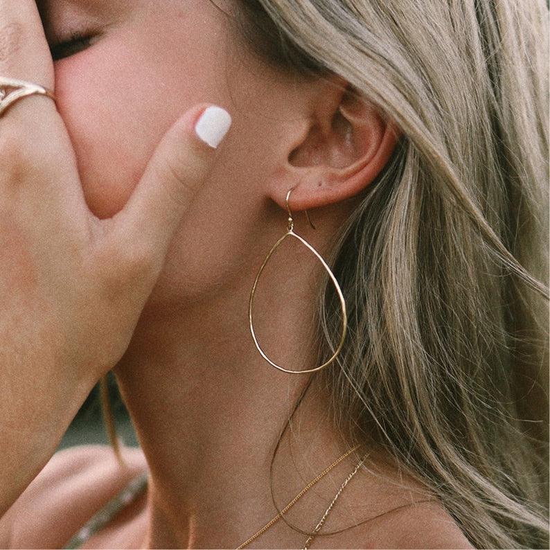 Woman wearing Gold Earrings - womens gold jewellery Australia 