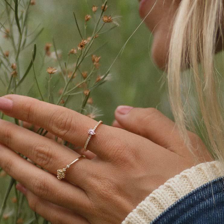 Girl wearing dainty Gold Topaz and Rose Quartz Rings - womens rose quartz jewellery by indie and harper