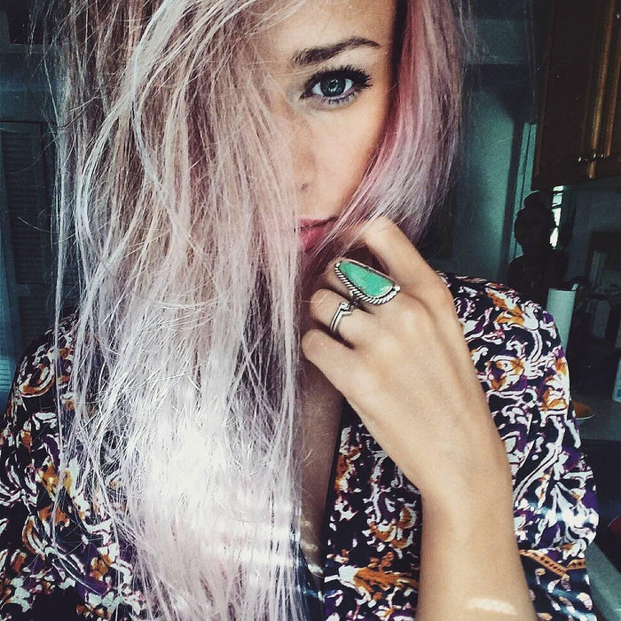 Young woman wearing sterling silver turquoise jewellery in natural light