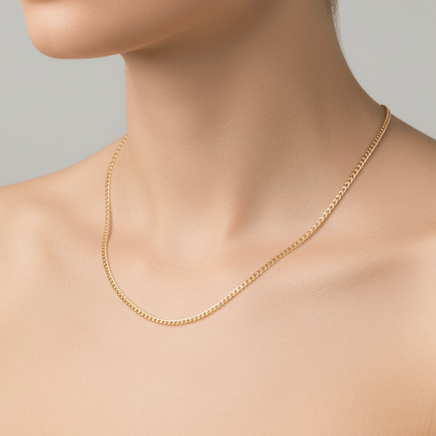 Woman wearing a dainty gold chain necklace 
