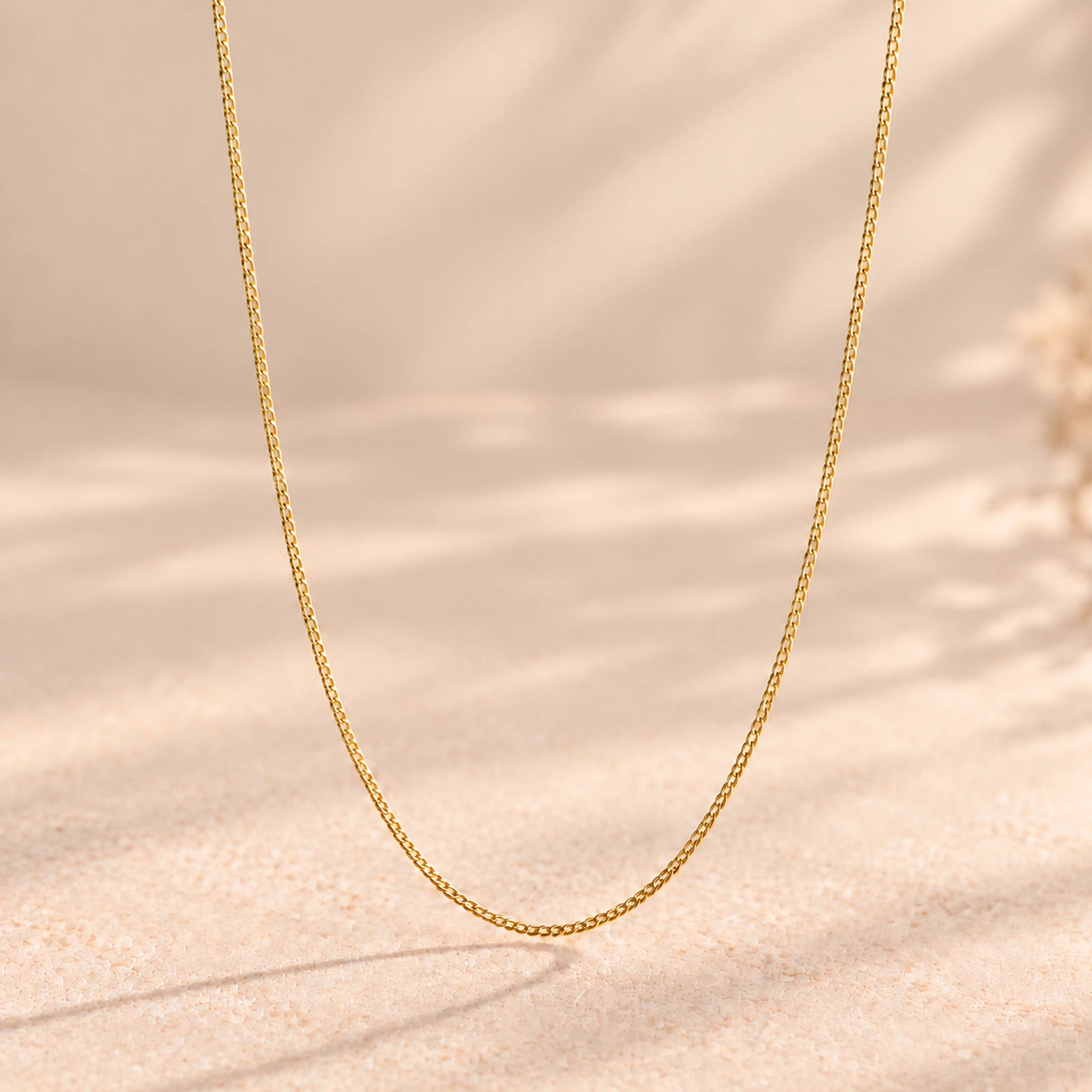 9k gold fine curb chain necklace hanging