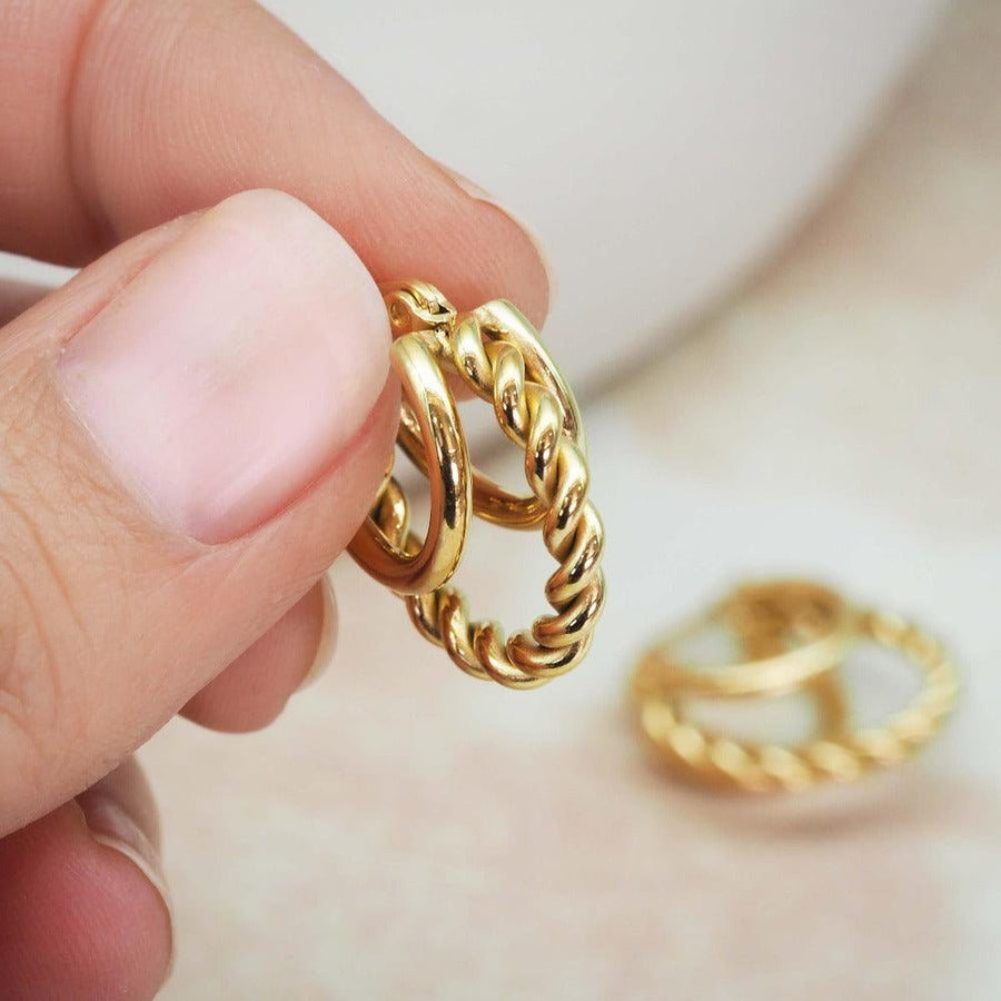 Hand holding gold hoop earrings - womens gold waterproof jewellery by Australian jewellery brand indie and harper