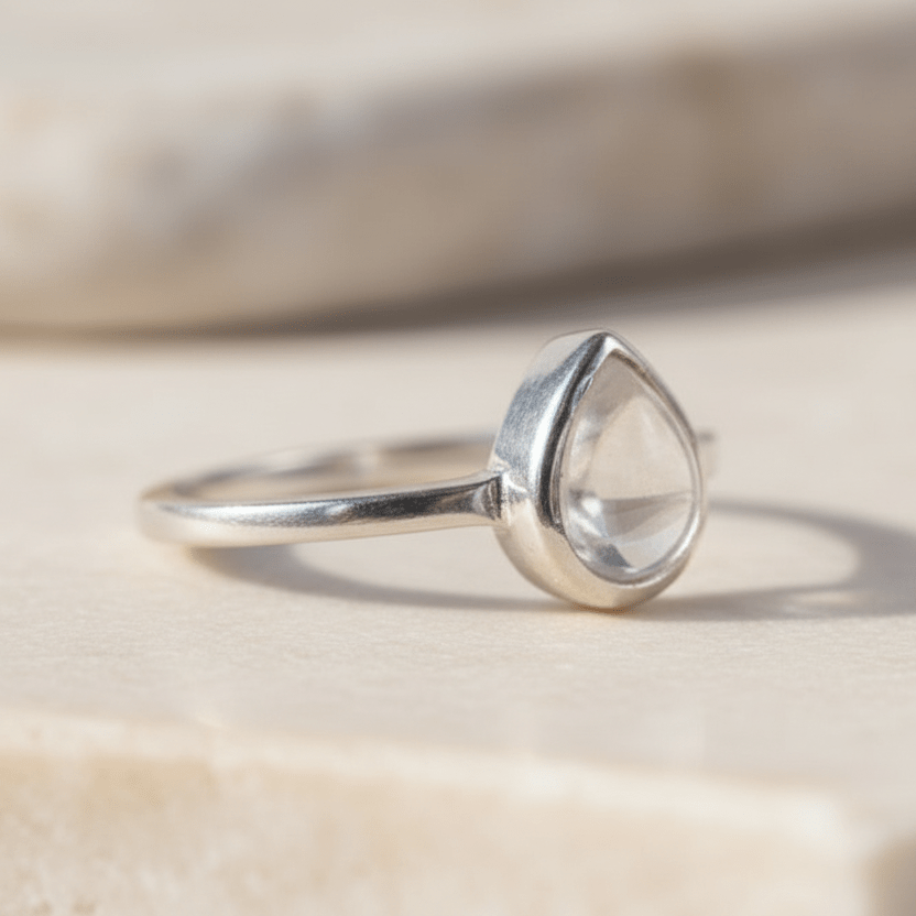 sterling Silver ring with a teardrop-shaped herkimer quartz gemstone on a light background