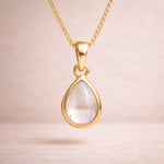 Gold april birthstone necklace with a pear-shaped natural clear quartz gemstone pendant - birthstone jewellery gift for her