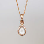 Rose Gold april birthstone necklace with a pear-shaped natural clear quartz gemstone pendant - birthstone jewellery gift for her