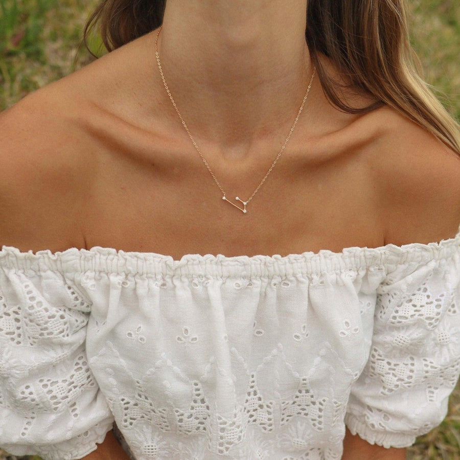 Woman wearing dainty rose gold Necklace - womens constellation jewellery Australia 