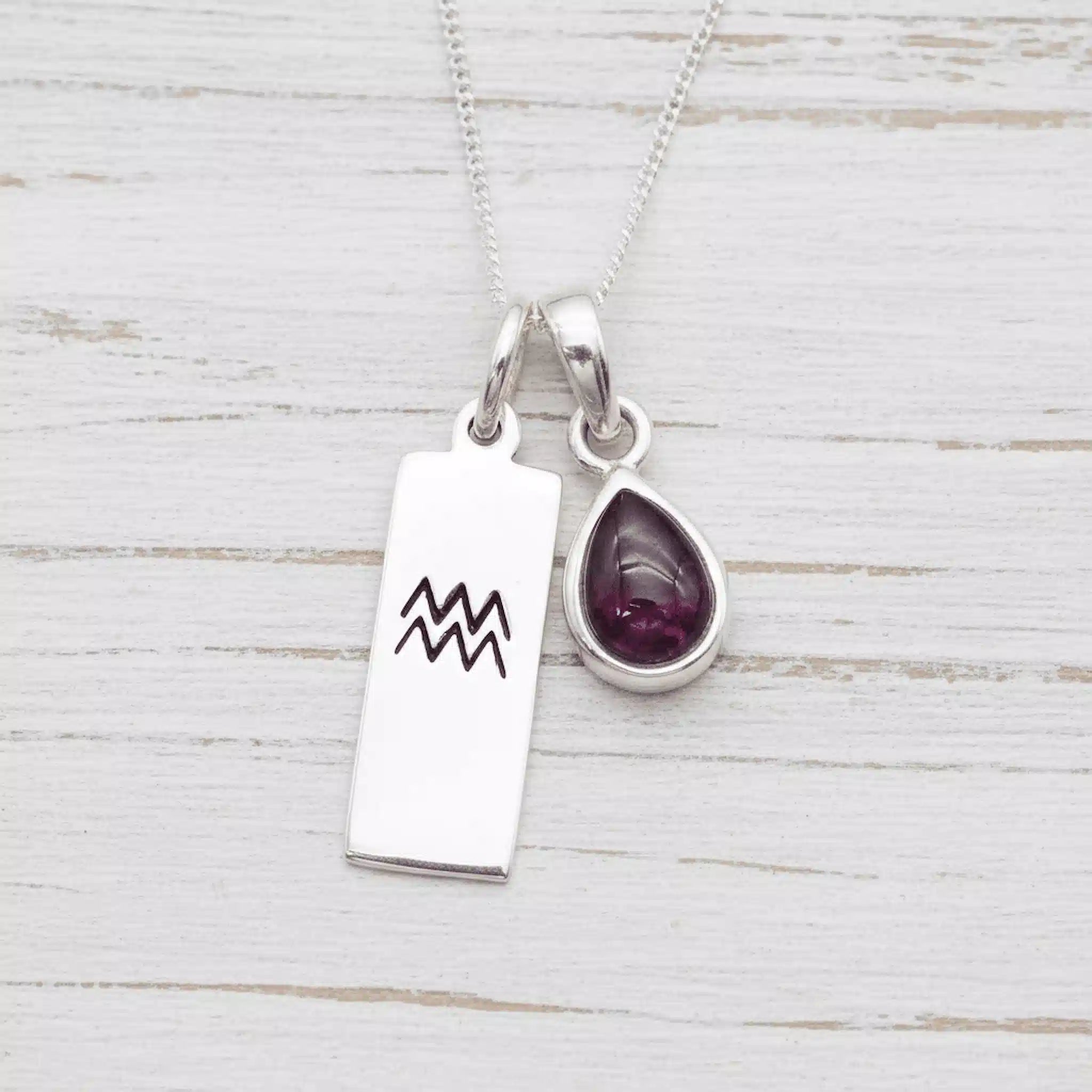 Sterling Silver January Birthstone Necklace with a pear-shaped natural Garnet gemstone pendant and Aquarius Zodiac pendant