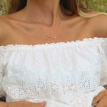 woman wearing a rose gold constellation necklace