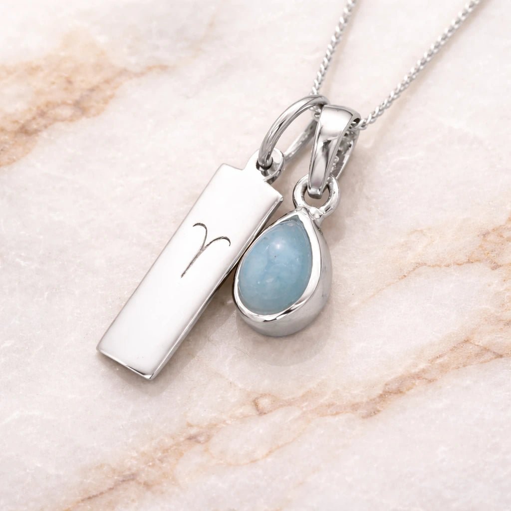 Sterling Silver March Birthstone Necklace with a pear-shaped natural Aquamarine gemstone pendant and Aries Zodiac pendant