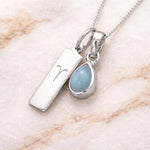 Sterling Silver March Birthstone Necklace with a pear-shaped natural Aquamarine gemstone pendant and Aries Zodiac pendant