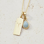 Gold March Birthstone Necklace with a pear-shaped natural Aquamarine gemstone pendant and Aries Zodiac pendant