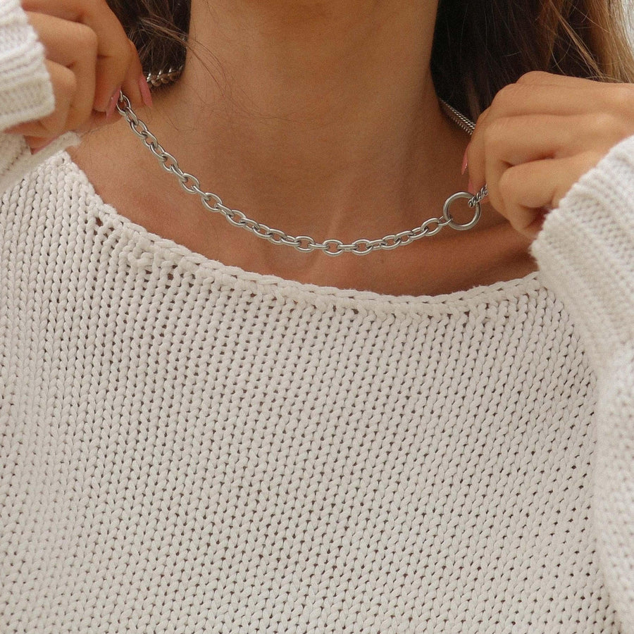 woman wearing a white jumper wearing silver necklace - waterproof silver jewellery australia