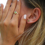 indie and harper gold august birthstone peridot earrings and ring being worn