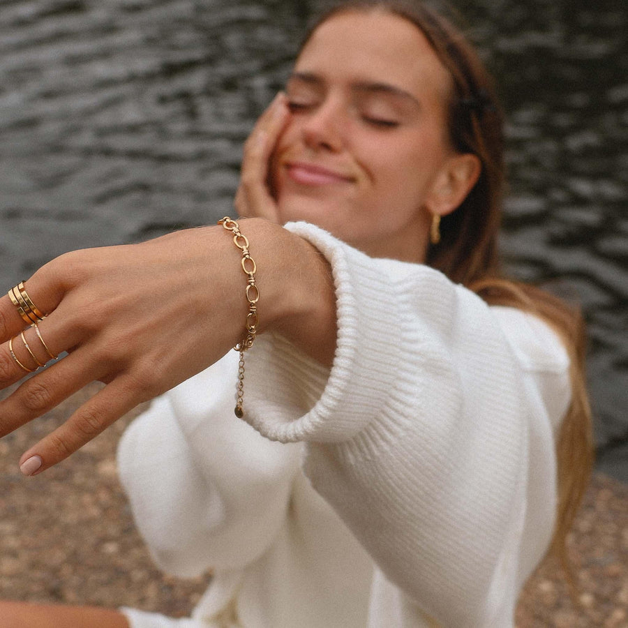 woman in white jumper wearing gold bracelet - womens gold waterproof jewellery - Australian jewellery online