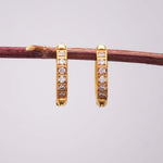 dainty gold huggie earrings - gold waterproof jewellery by indie and harper australia