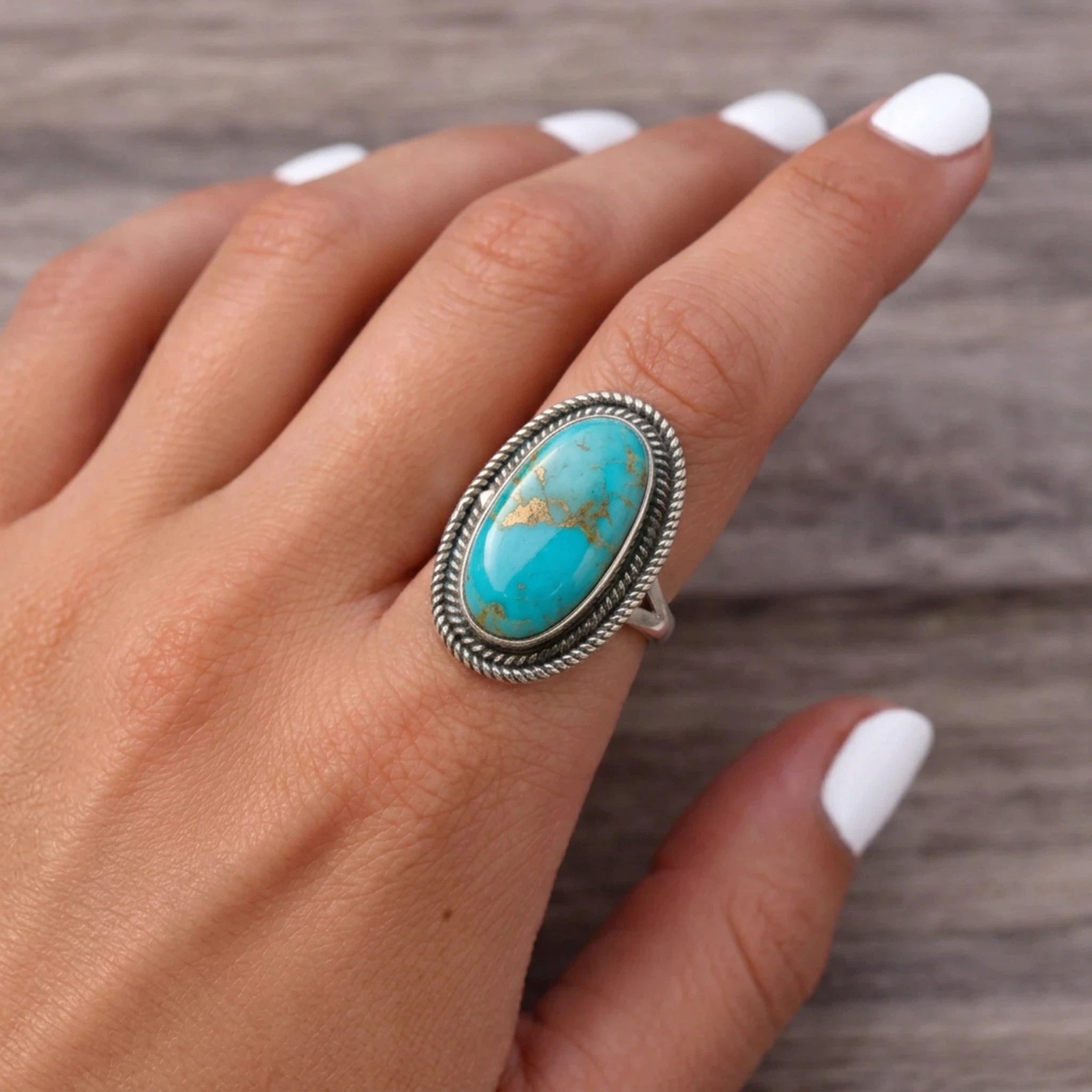 finger wearing a Sterling Silver Boho Ring with mohave turquoise gemstone 