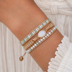 bohemian style beaded wrap bracelet with gold and moonstone worn