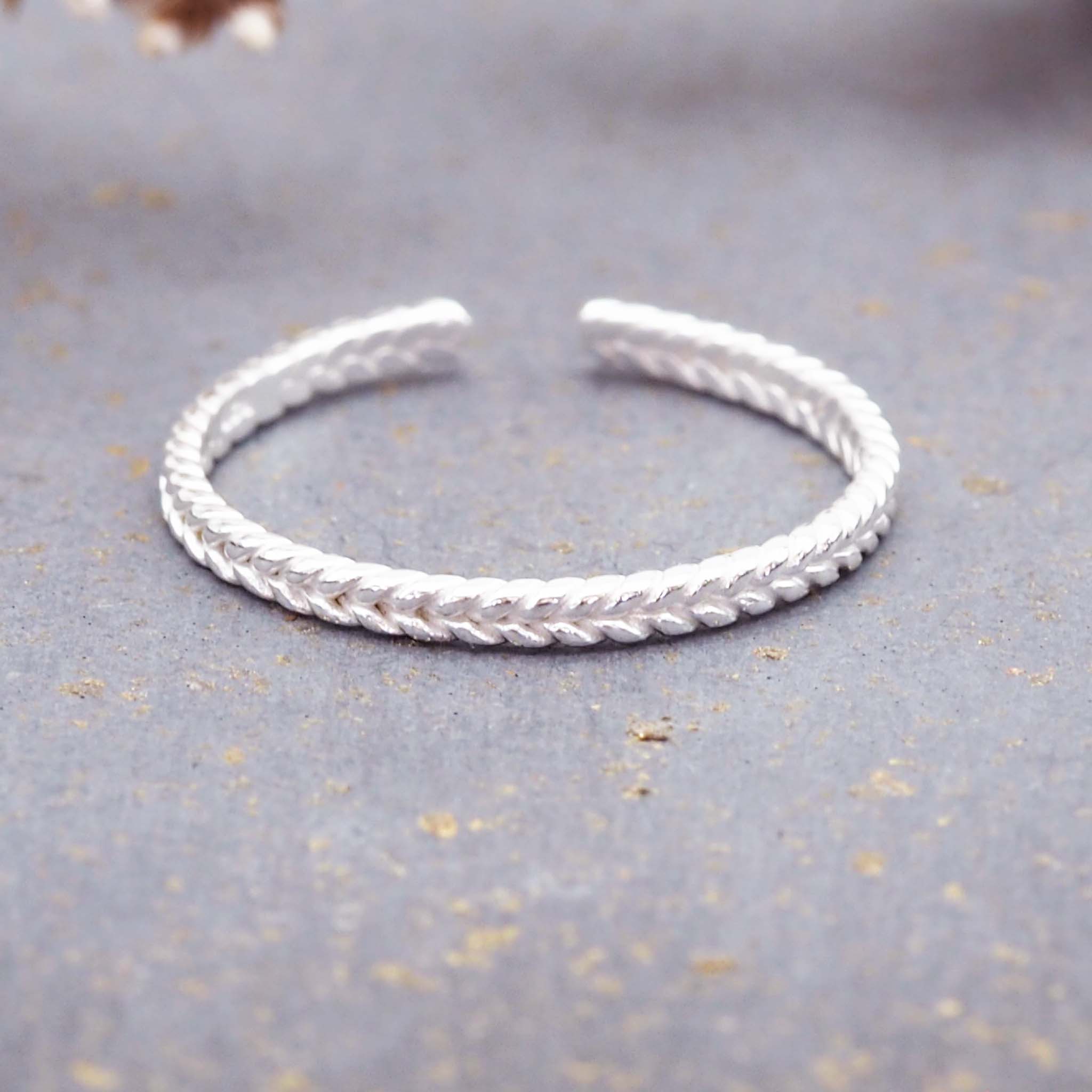braided toe ring made with sterling silver and semi adjustable