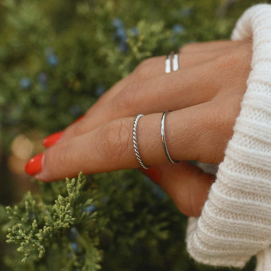 Woman with red nail polish wearing silver Stacker Rings - womens waterproof jewellery by Australian jewellery brand indie and harper