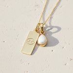 Gold Necklace with a June Birthstone Pearl pendant and a cancer zodiac star sign pendant