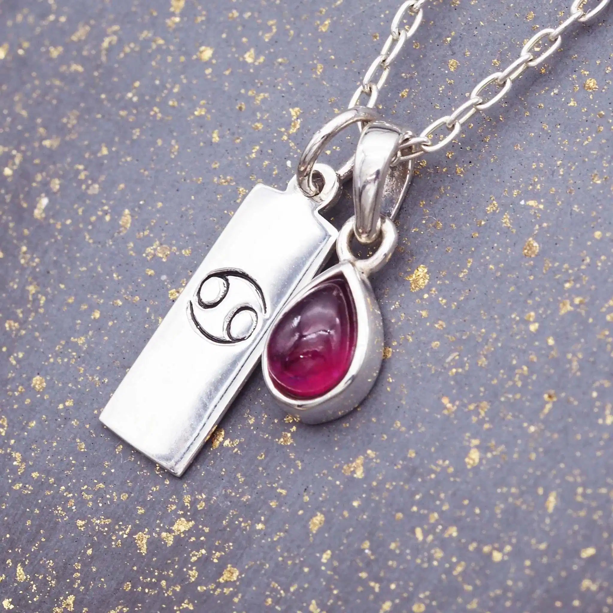 Sterling Silver July Birthstone necklace with a pear-shaped natural Ruby pendant and a Cancer zodiac pendant