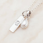 Sterling Silver Necklace with a June Birthstone Pearl pendant and a cancer zodiac star sign pendant
