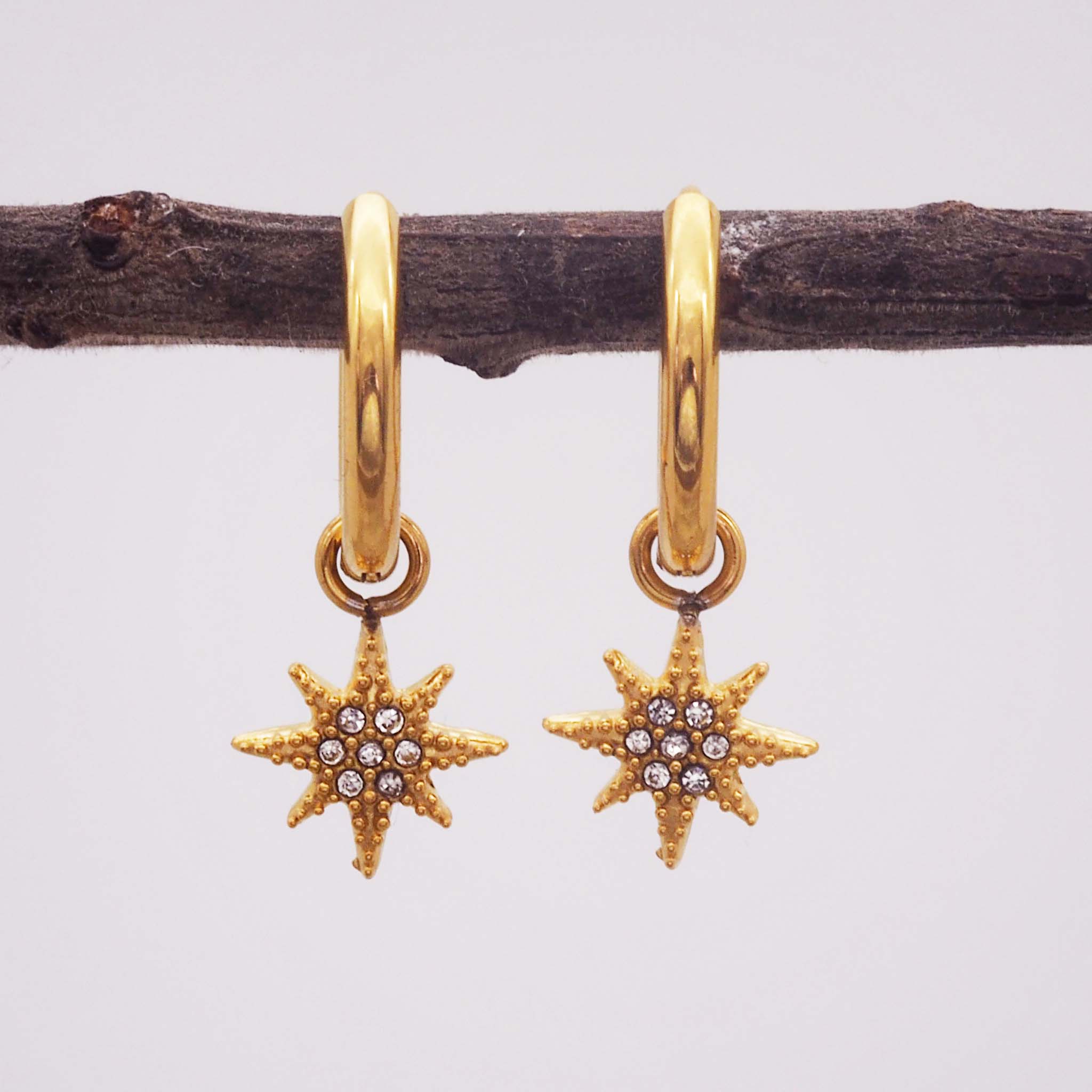 celestial glimmer gold star hoop earrings by indie and harper australia