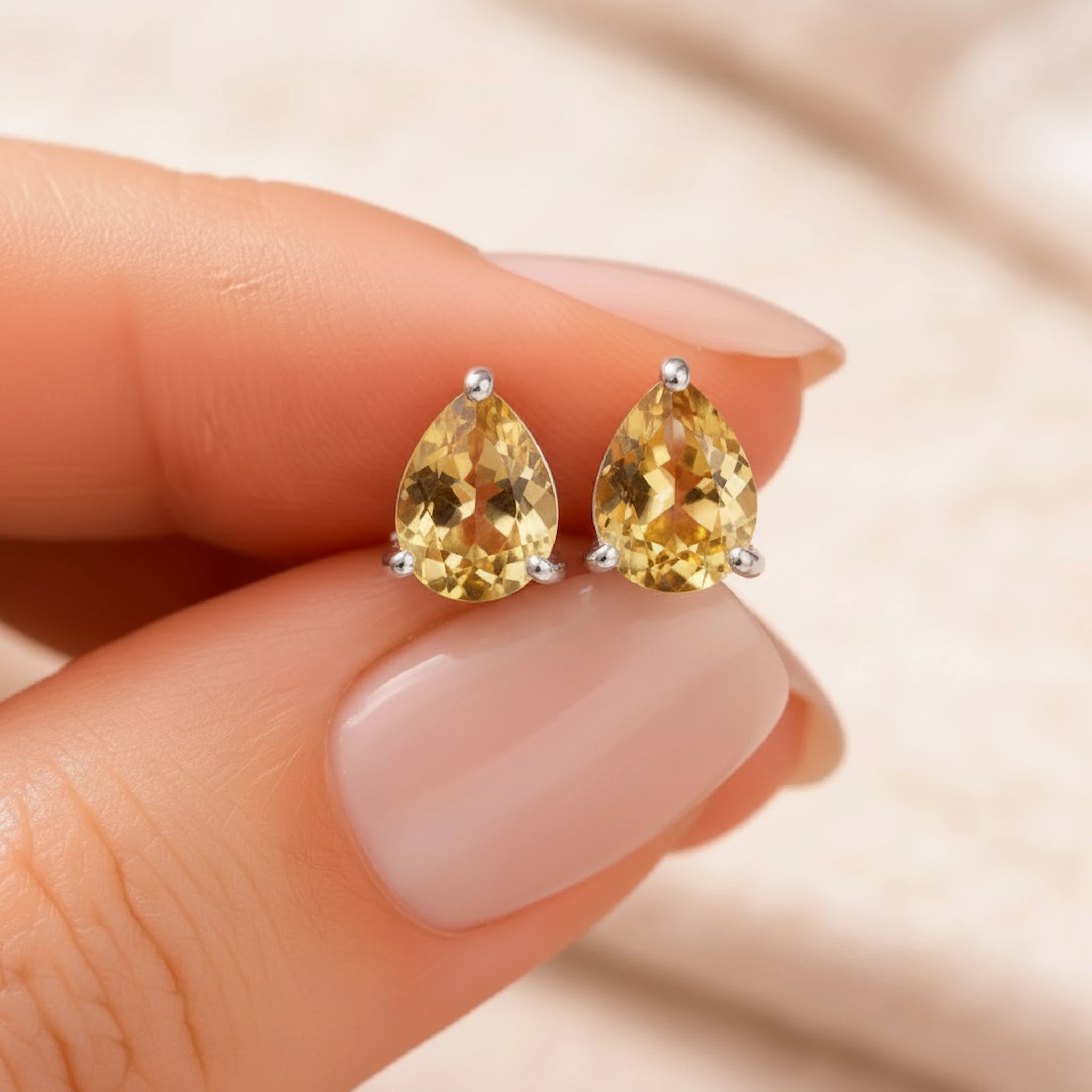 Citrine Pear-Shaped Stud Earrings in 925 sterling silver with faceted natural yellow gemstones and claw settings