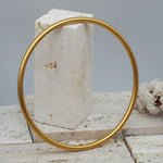 Thin gold bangle bracelet with brushed gold finish - waterproof jewellery