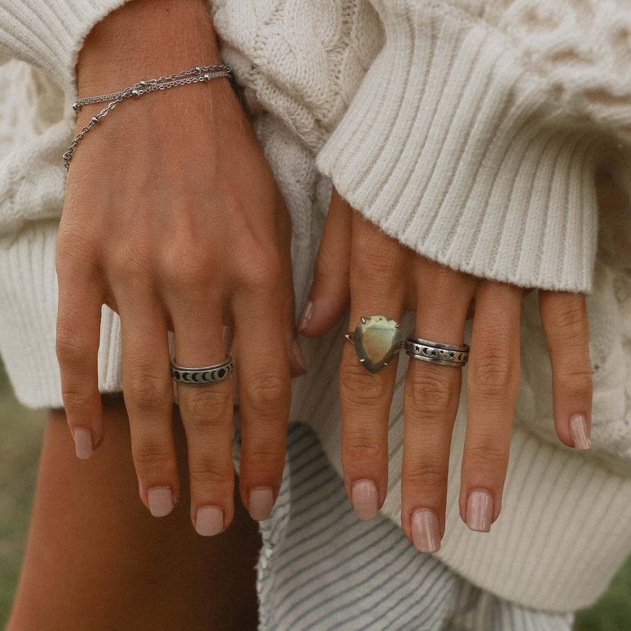 women with white wool jumper wearing silver boho rings - Australian jewellery brand