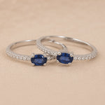 Classic sapphire pavé stackable ring in rhodium-plated 925 sterling silver with an oval blue sapphire, four-prong setting and slim cubic zirconia band
