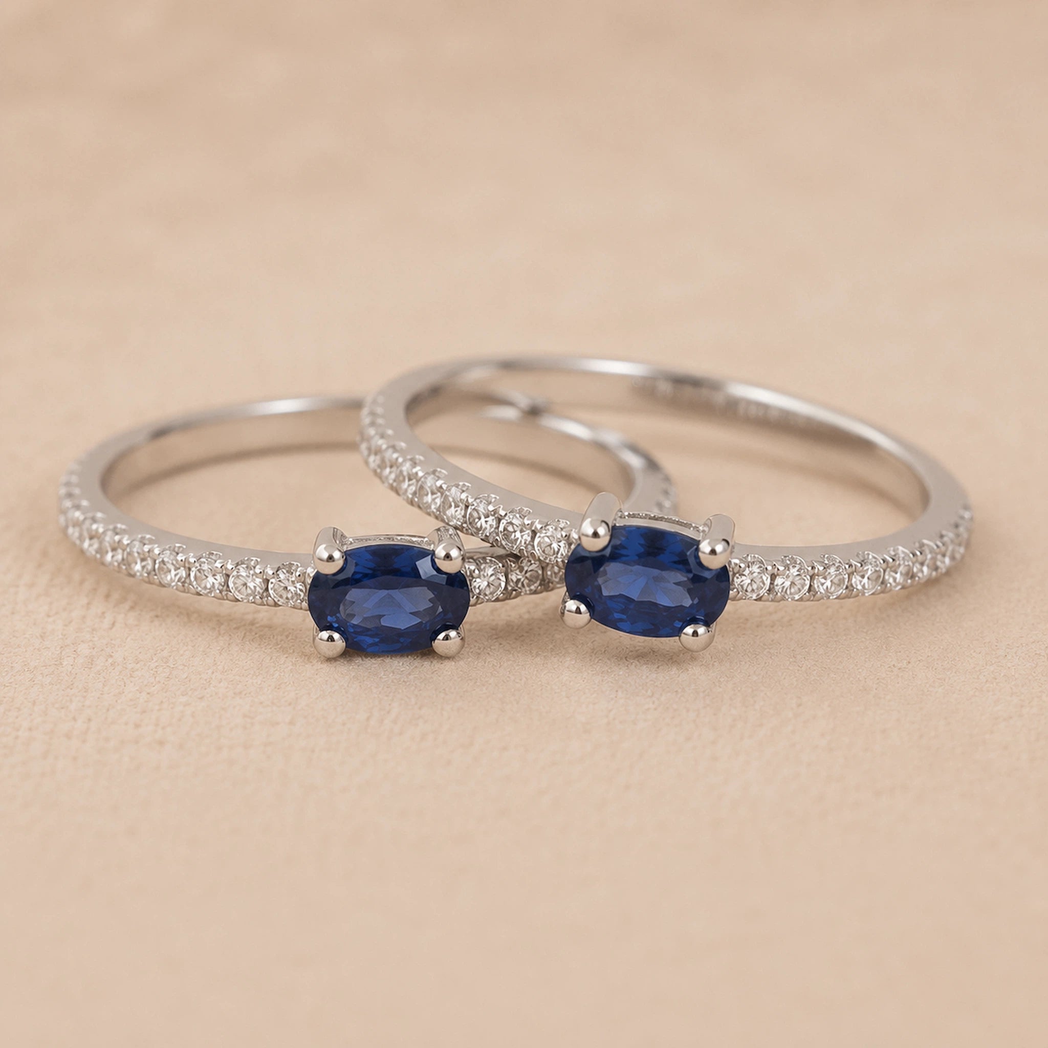 Classic sapphire pavé stackable ring in rhodium-plated 925 sterling silver with an oval blue sapphire, four-prong setting and slim cubic zirconia band