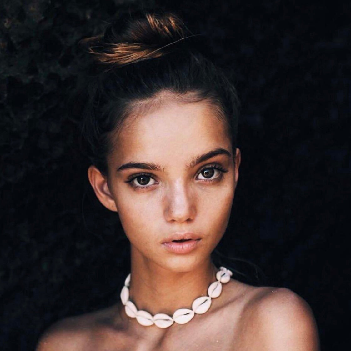 woman wearing cowrie sea shell necklace by indie and harper australia