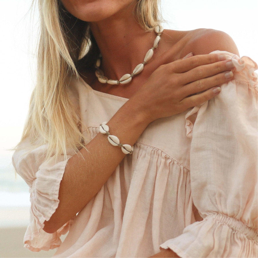 Woman wearing Cowrie Sea Shell jewellery - australian jewellery brand