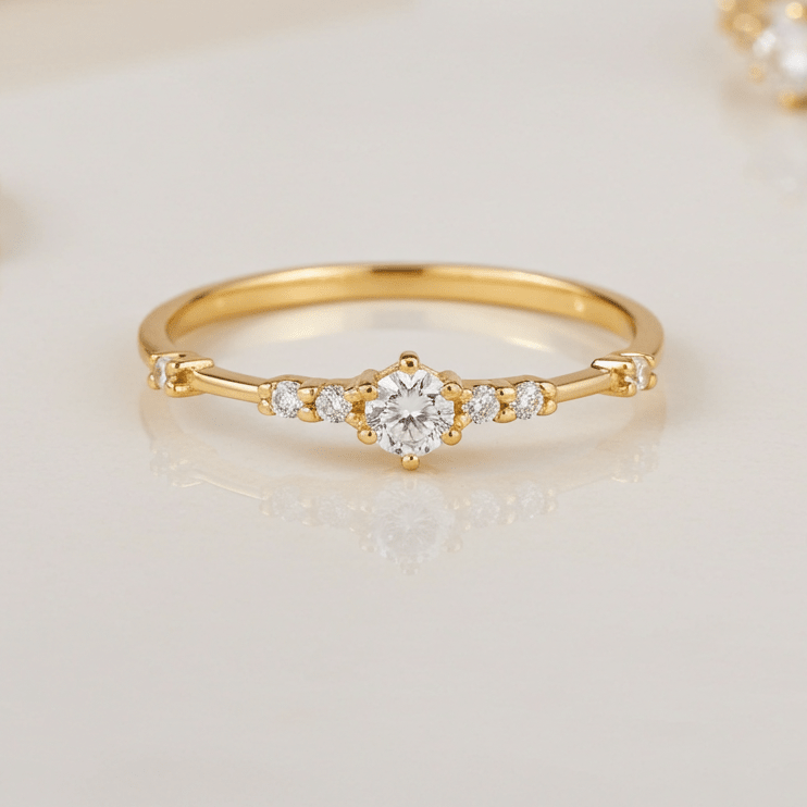 Gold ring with cubic zirconias on a light background