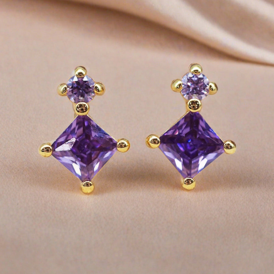 dainty gold stud earrings with purple crystals 