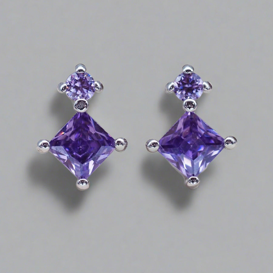 dainty sterling silver stud earrings with purple crystals