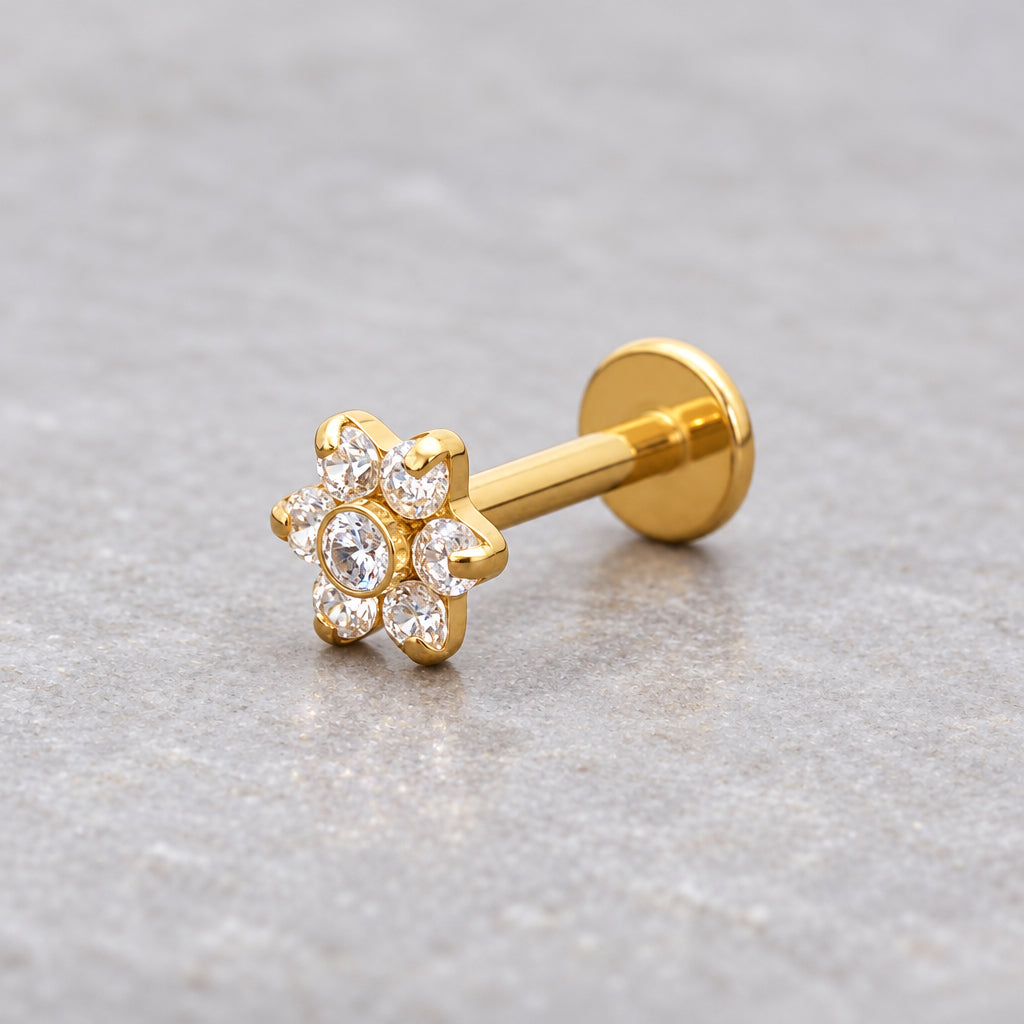 Gold flower helix flat back stud, close-up