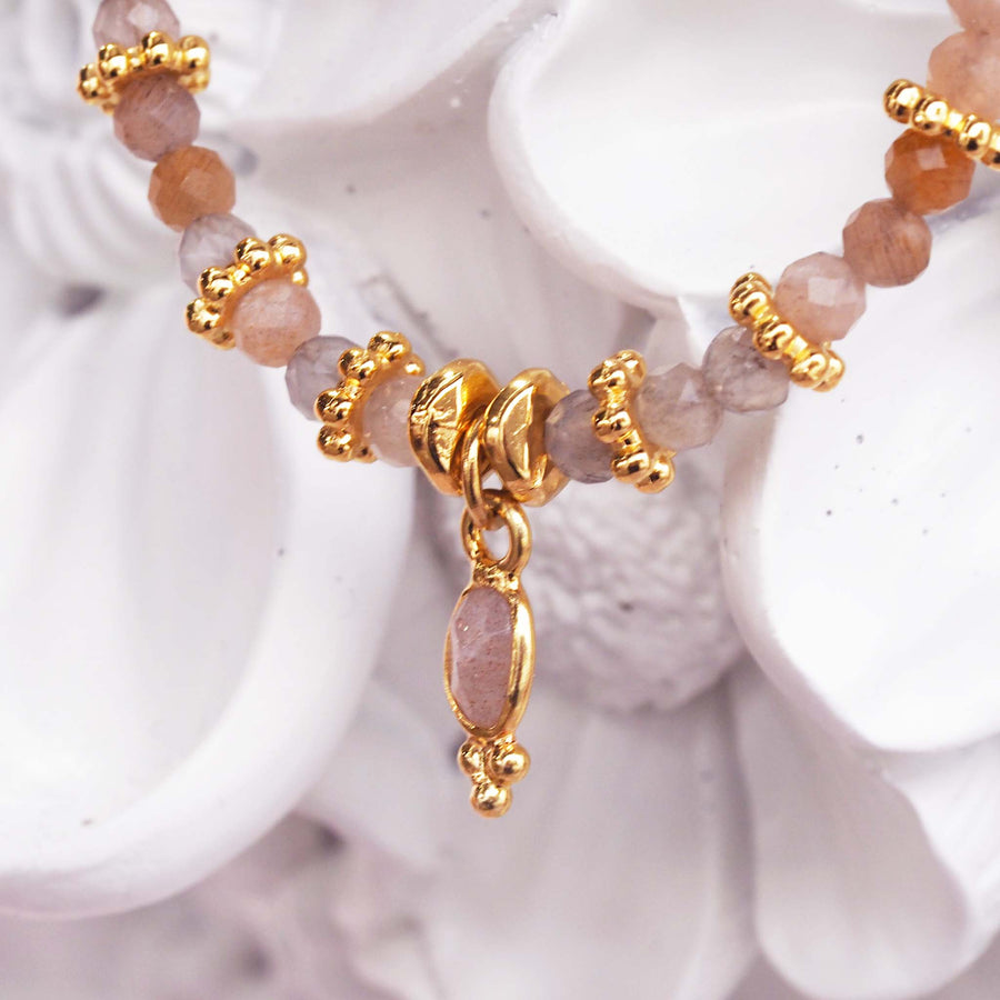 dainty goddess orange moonstone bracelet - dainty beaded bracelet made with gold plated stainless steel charms and natural orange moonstones by indie and harper