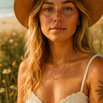 dainty gold chain necklace being worn