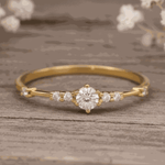 Gold ring with a czs on a wooden surface