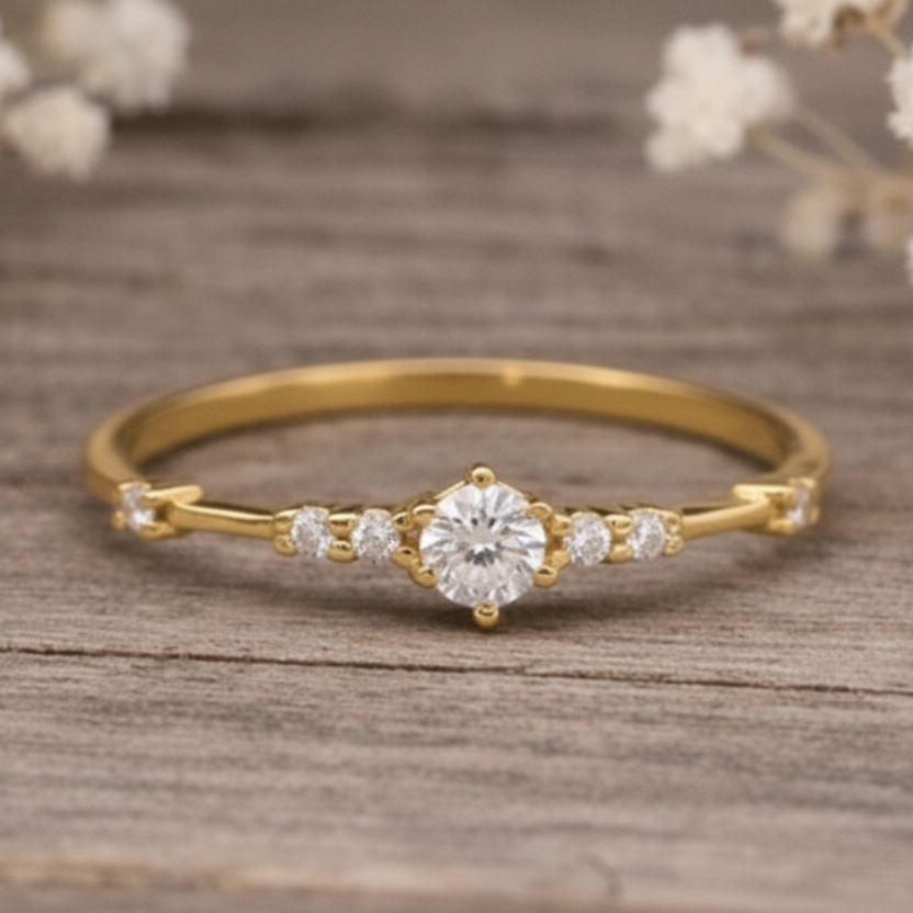 Gold ring with a czs on a wooden surface